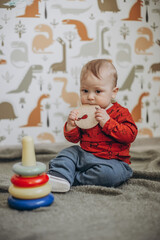 Fototapeta premium little boy playing in the children's room