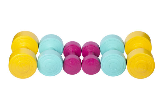 Three pairs of bright colored athletic rubber dumbbells, png isolated on transparent background
