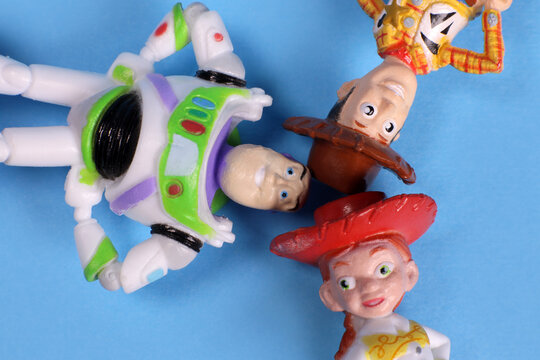 Magdalinovka, Ukraine - March 1, 2022. Sheriff Woody, Jessie and Buzz Lightyear from Toy Story lie on their backs and look up at the sky