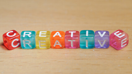 "creative" word in colorful cubes. concept of creative life. fun concept about being a creative person