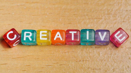 "creative" word in colorful cubes. concept of creative life. fun concept about being a creative person