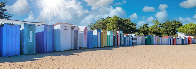 Wooden beach cabins on the Oleron island in France, colorful huts
