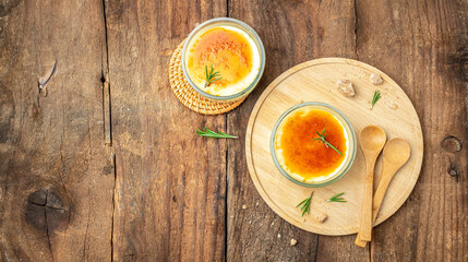two delicious cream brulee or brule, traditional french vanilla cream dessert with caramelised sugar, place for text, top view