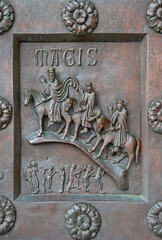 A fragment of the bronze entrance door Baptistery in Pisa, Italy