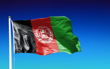Naklejka na ściany i meble Flag Afghanistan AF waving asian islamic against blue sky outdoor background 