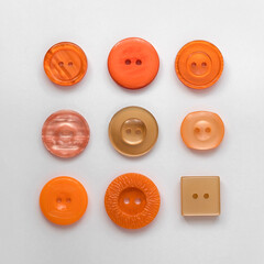 Retro orange plastic buttons on a white background. Sewing tools. Top view.