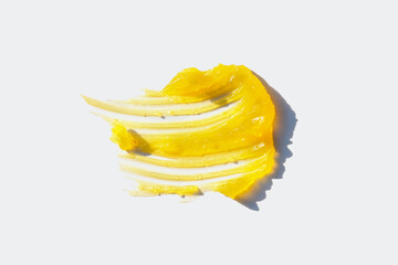 Background of natural cosmetics with yellow oil texture for skin care products