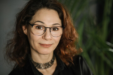 Closeup portrait of brunette woman with glasses