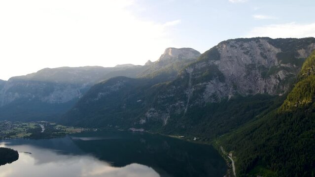 Top view of Hallstattersee lake and mountain in sunset, stock video of Austria nature
