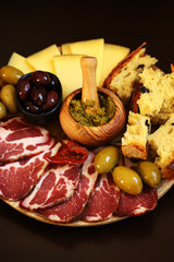 Italian board. Cheese, ham, olives, Italian bread.