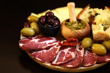 Italian board. Cheese, ham, olives, Italian bread.