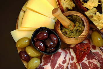 Italian board. Cheese, ham, olives, Italian bread.