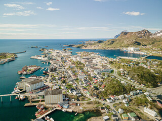 Aerial footage of Svolvaer in Lofoten, Norway, during a sunny spring day with few clouds and blue sky