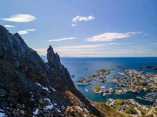 Fototapeta na wymiar Aerial footage of Svolvaer in Lofoten, Norway, during a sunny spring day with few clouds and blue sky