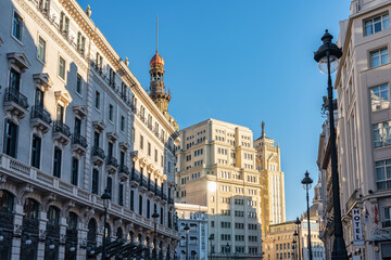 Monumental and picturesque ensemble of buildings in the central district of the European city of Madrid, Spain. - obrazy, fototapety, plakaty