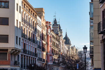 Fototapeta premium Monumental and picturesque ensemble of buildings in the central district of the European city of Madrid, Spain.