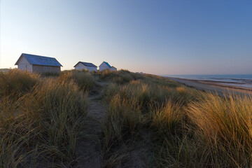 Colored cabins in Gouville-sur-Mer village. Cotentin coast