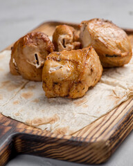 Grilled chicken fillet on a board