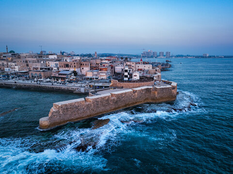 Acre (Akko) is a port city located on the Mediterranean coast and is known for its well-preserved ancient city fortifications. .Aerial footage of the old city, the ancient port and marina.