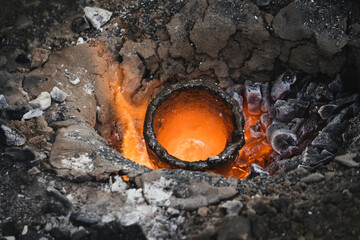 Liquid bronze is being heated to 1200°C. Casting bronze jewelry, Celtic Metalsmith. Experimental...