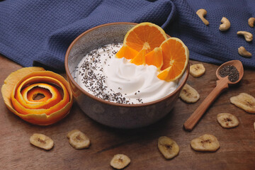 Bowl with Greek yogurt and fruit with nuts, seeds