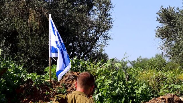 Israeli Soldier kisses the Flag of Israel and then salutes the Flag. Video themes: Tzahal - IDF or Israel Defense Forces, Soldiers, Independence Day Israel, Patriotism and Army
