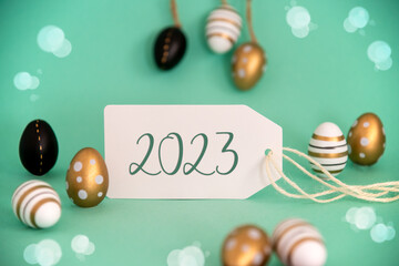 Fototapeta na wymiar Golden Easter Egg Decoration. Label With Text 2023