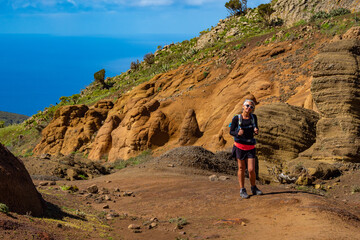 Female hiker hiking the mountains of Teno Alto in Tenerife Canary Islands