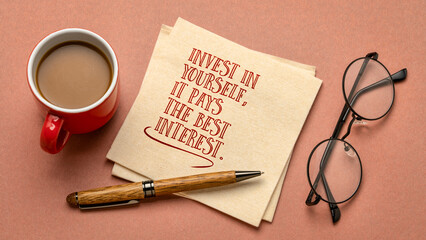 Invest in yourself, it pays the best interest. Motivational advice or reminder - handwriting on a...