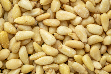 closeup background of shelled pine nuts, top view