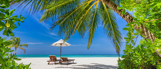 Beautiful tropical island, couple chairs umbrella under palm tree leaves, paradise sea sand sky....