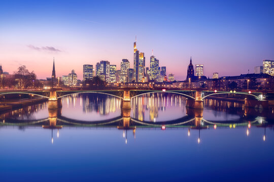 Frankfurt skyline with purple light and Alte Brucke (Old Bridge) - Frankfurt, Germany