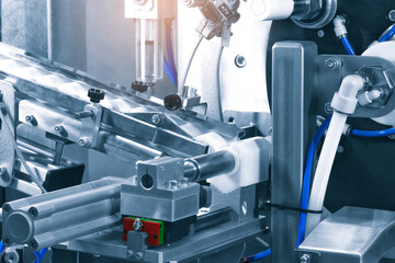 pharmaceutical industry, medicine pills are filling in the  plastic bottle on production line machine conveyor at the medical factory. selective focus.