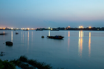 Boat in the river Ganges at Kolkata. Photo has been taken in Kolkata at West Bengal in beautiful blue light at evening.
