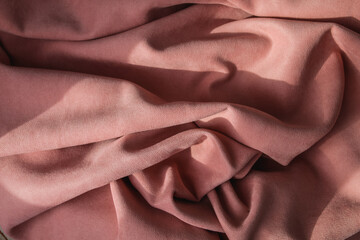 Folds of pink fabric