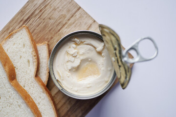 full cream preserved in a tin container on table 