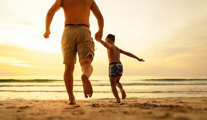 Father and son running on the beach 