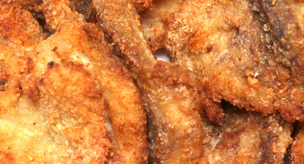 Breaded fried fish. fried fish texture. meal details. Breaded seafood.