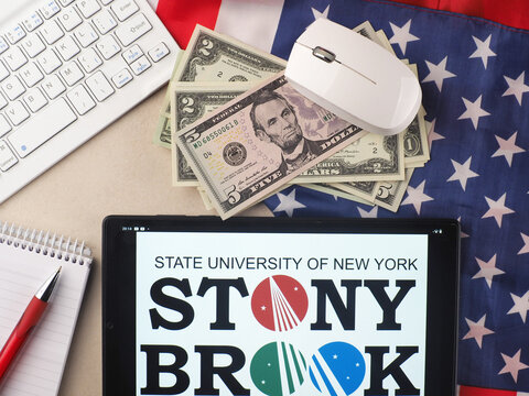 In this photo illustration, Stony Brook University  logo seen displayed on a tablet.