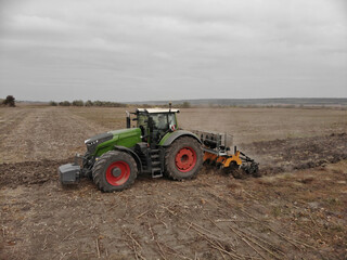 Tractor working in the field in Ukraine