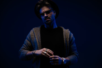 fashion model holding hands and posing with style