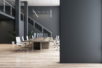 Blank black partition with place for advertising poster or logo in modern interior design spacious office hall with conference table, wooden floor and dark wall background. 3D rendering, mock up - obrazy, fototapety, plakaty