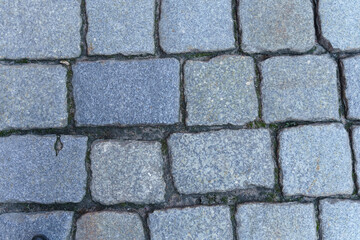 Abstract background of old cobblestone close up.