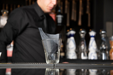 cocktail glass with napkins in a bar