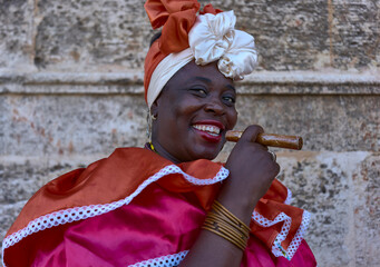 Cuban canastera with habano and typical costume