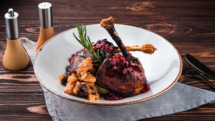 Fried duck with cranberry sauce, mashed potatoes and baked apple slices.