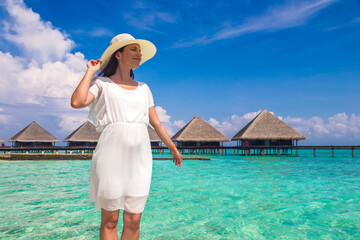 Woman standing on the wooden pier