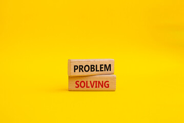 Problem solving symbol. Concept word Problem solving on wooden blocks. Beautiful yellow background. Business and concept. Copy space