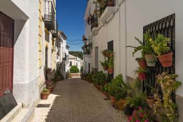 Beautiful street with its typical white facades in Almonaster La Real in Huelva province, Andalucia, Spain.