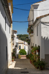 Beautiful street with its typical white facades in Almonaster La Real in Huelva province, Andalucia, Spain.